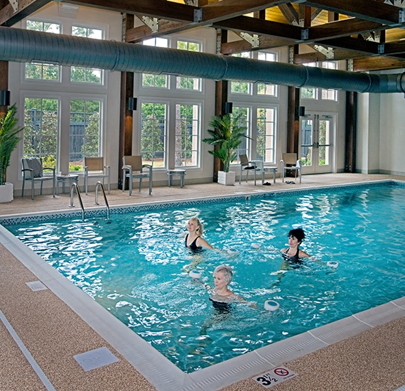 Retirement Residents Exercising At Carolina Bay Wellness Pool